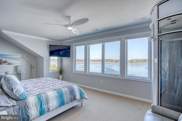 bedroom with ceiling fan, carpet, and crown molding