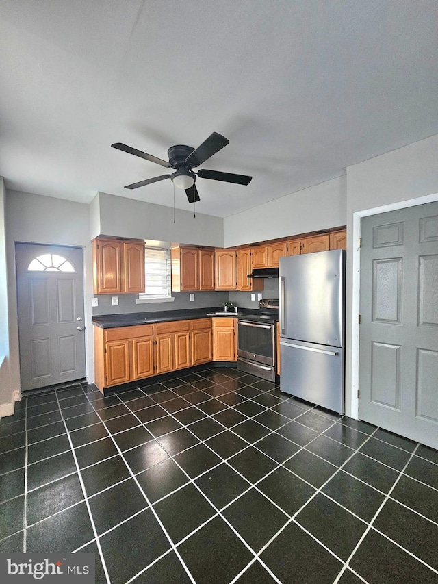 kitchen with ceiling fan and appliances with stainless steel finishes