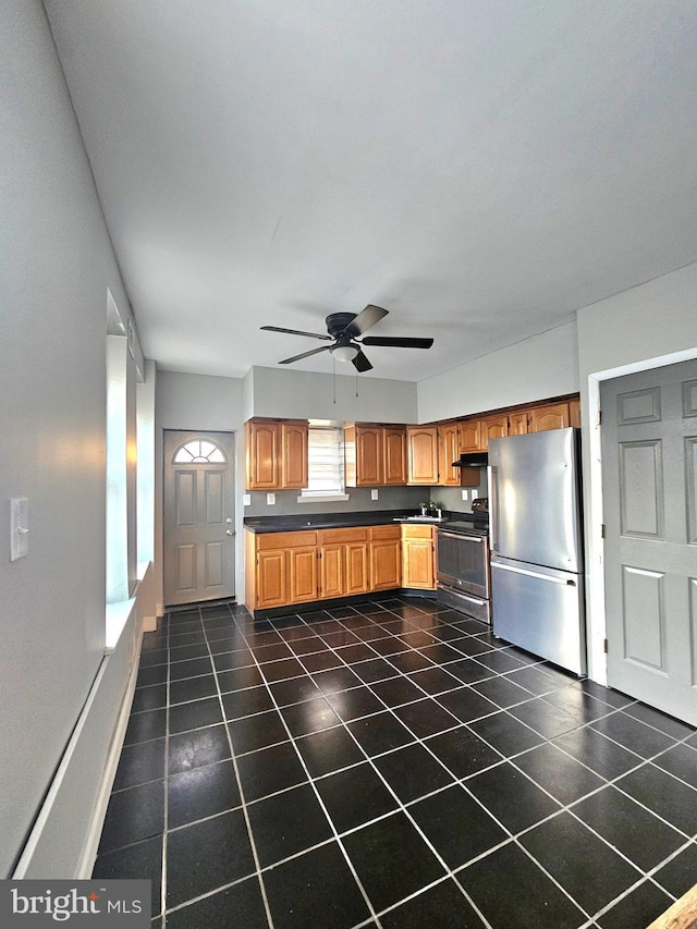 kitchen with ceiling fan and appliances with stainless steel finishes