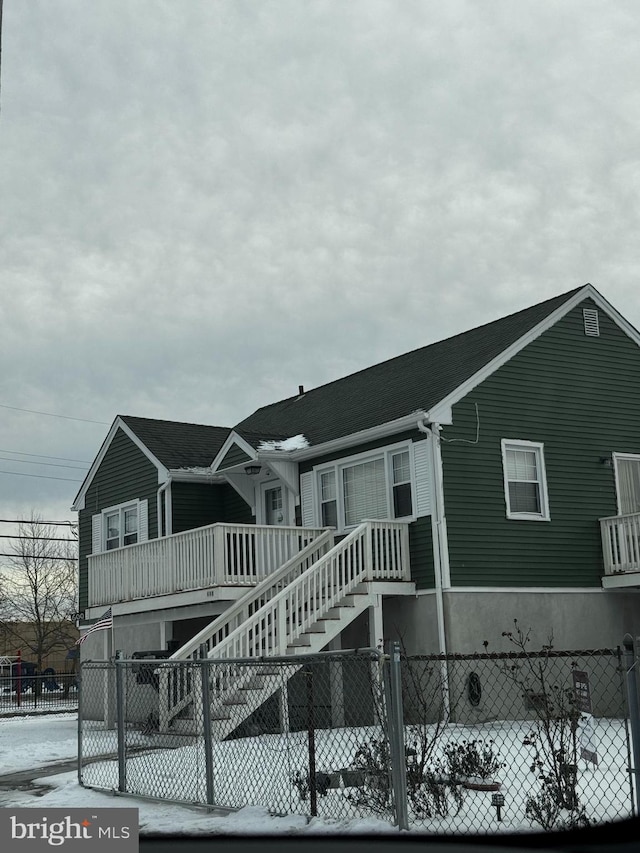 multi unit property featuring stairway and fence