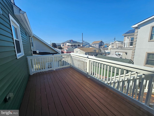 wooden deck featuring a residential view