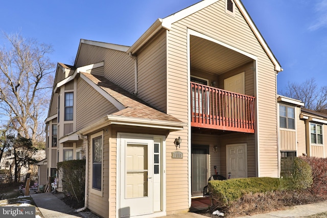 view of front of home featuring a balcony