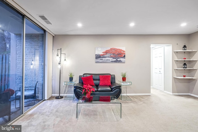 living area featuring light colored carpet