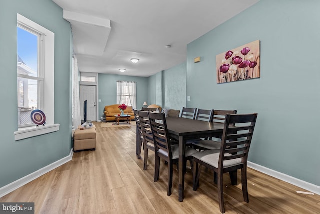 dining space with light wood-type flooring