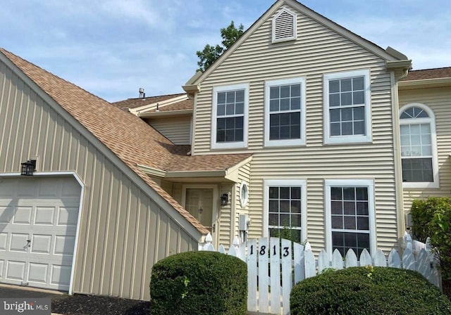 view of front of property with a garage