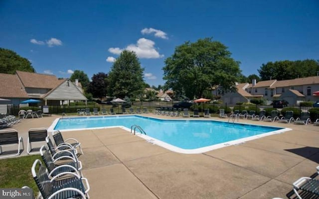 view of pool featuring a patio