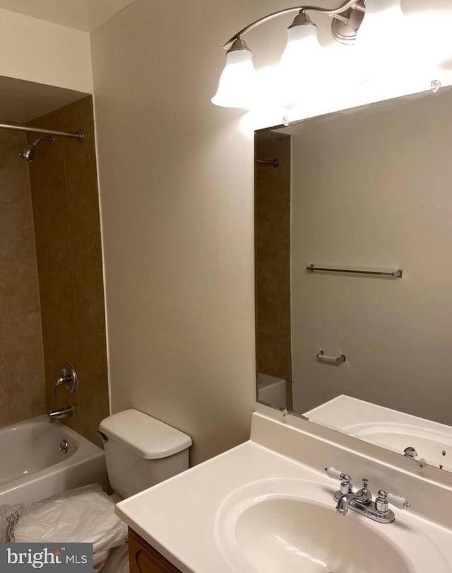 full bathroom with vanity, shower / bath combination, and toilet