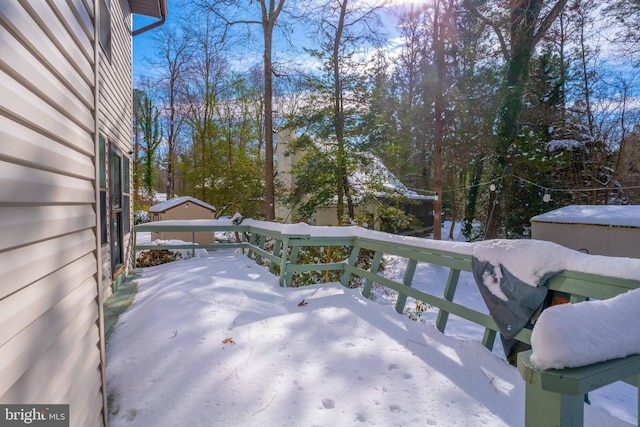 view of snow covered deck