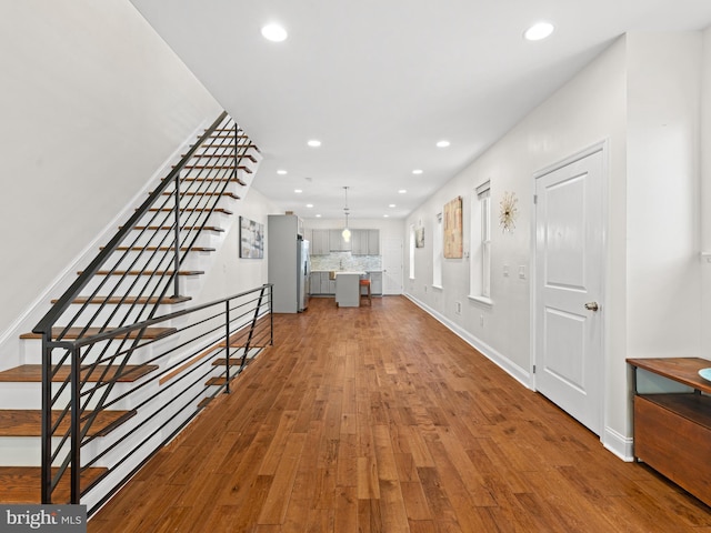 foyer entrance with hardwood / wood-style flooring