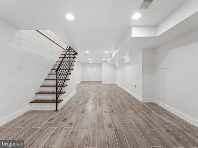 basement featuring light hardwood / wood-style floors