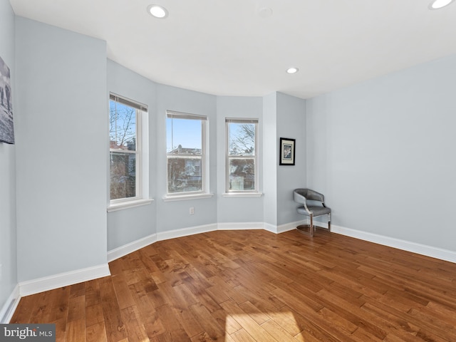 spare room with hardwood / wood-style floors