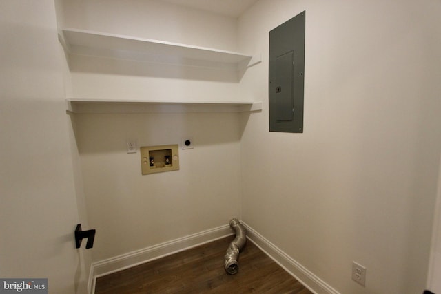 clothes washing area with dark wood-type flooring, electric panel, hookup for a gas dryer, hookup for a washing machine, and hookup for an electric dryer