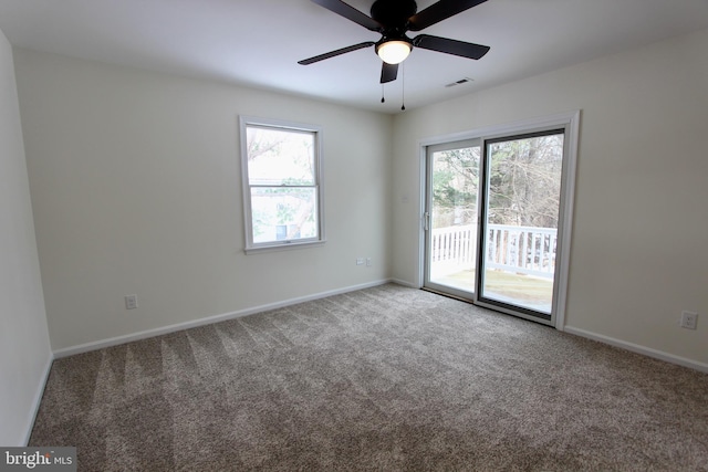 spare room with carpet flooring and ceiling fan