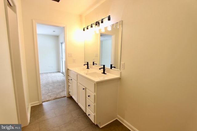 bathroom featuring tile patterned flooring and vanity