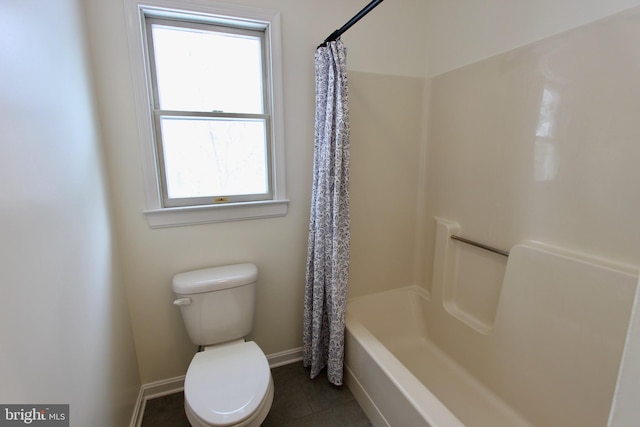 bathroom featuring tile patterned floors, plenty of natural light, shower / bath combo, and toilet