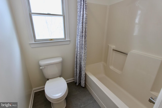 bathroom with tile patterned floors, toilet, and shower / tub combo with curtain