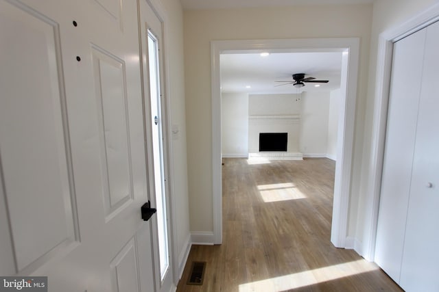 hallway featuring light wood-type flooring