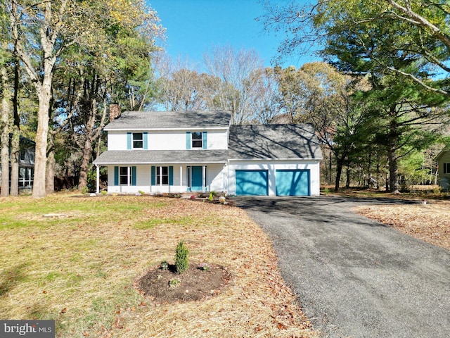 view of front property with a porch and a front yard