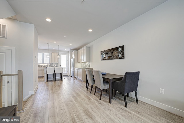 dining space featuring light hardwood / wood-style flooring