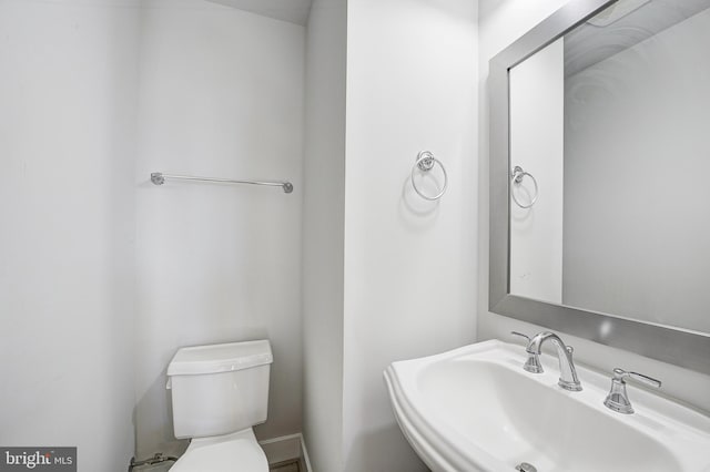 bathroom with sink and toilet