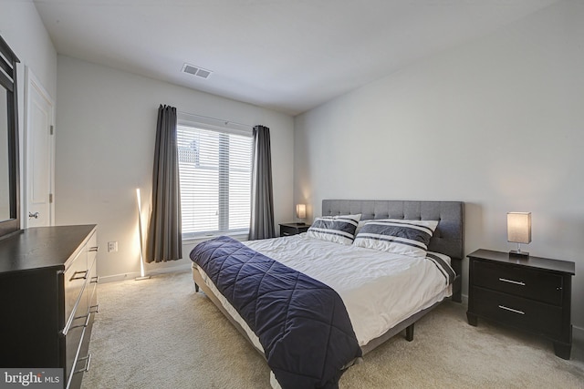 bedroom with light carpet