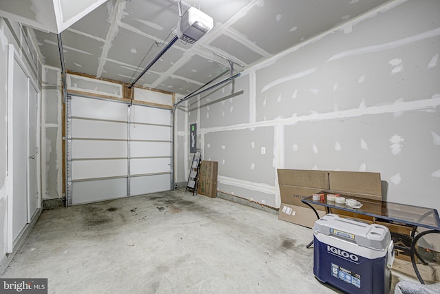 garage featuring a garage door opener and electric panel