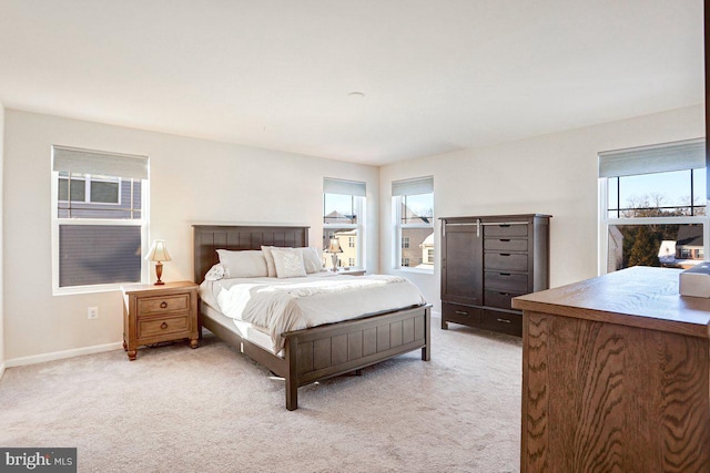 bedroom featuring light colored carpet