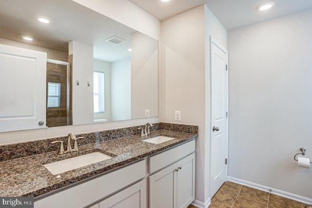 bathroom with vanity and an enclosed shower