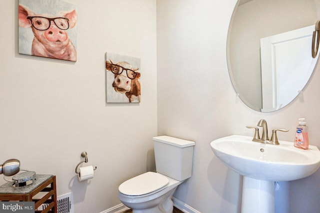 bathroom with toilet and sink