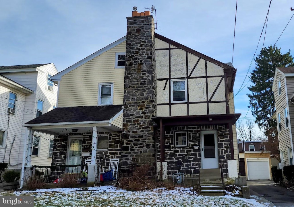 view of front of home featuring an outbuilding and a garage