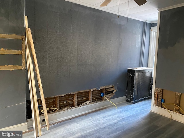 interior space featuring wood-type flooring and ceiling fan