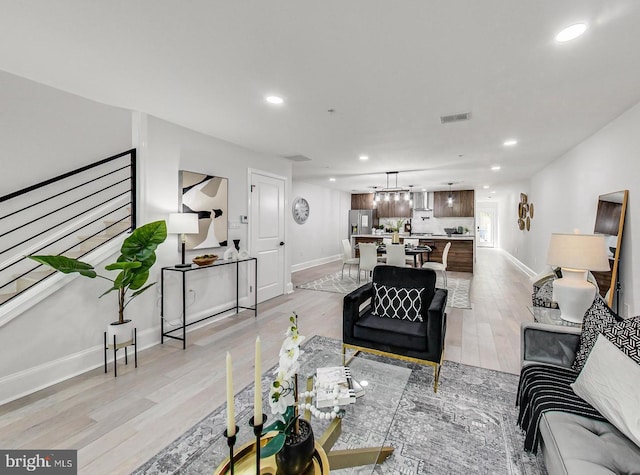 living room with light hardwood / wood-style floors