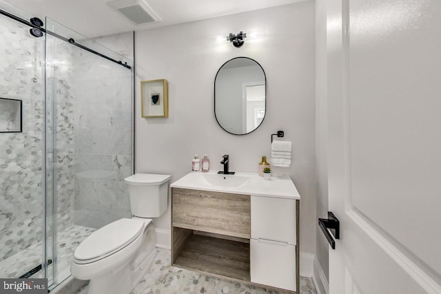 bathroom featuring walk in shower, vanity, and toilet