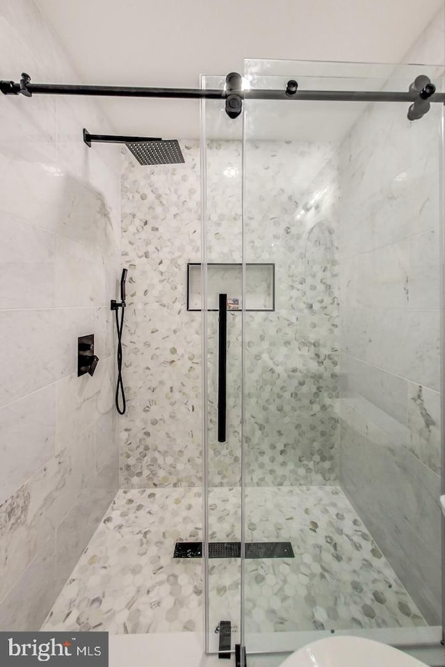 bathroom featuring an enclosed shower