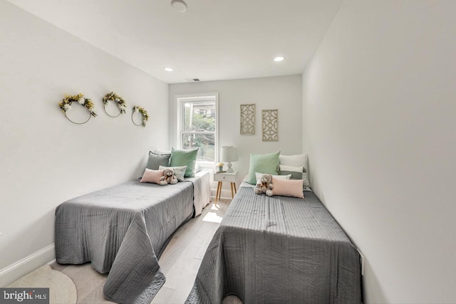 bedroom with light hardwood / wood-style floors