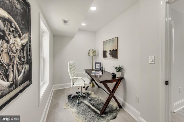 home office featuring light hardwood / wood-style flooring