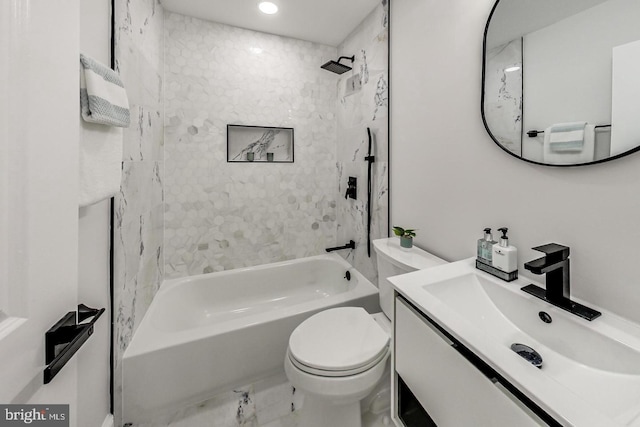 full bathroom featuring vanity, toilet, and tiled shower / bath