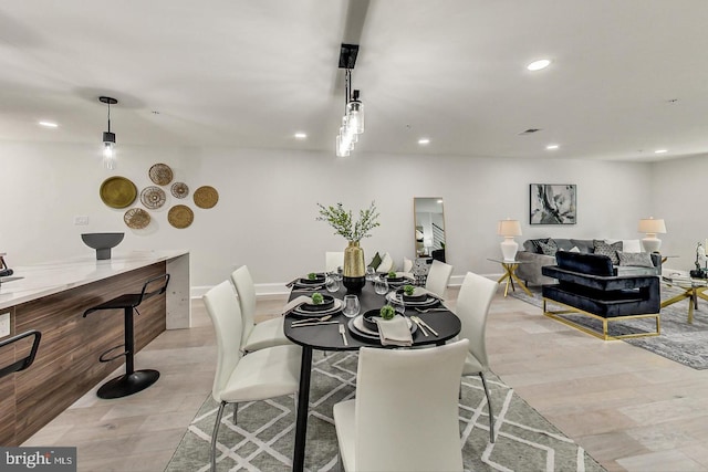 dining area with light wood-type flooring