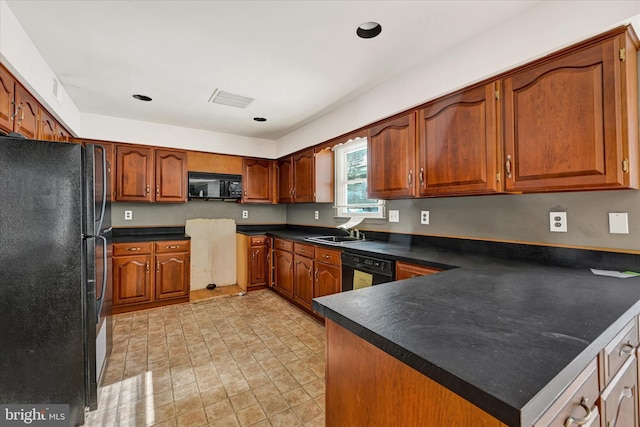 kitchen with sink and black appliances