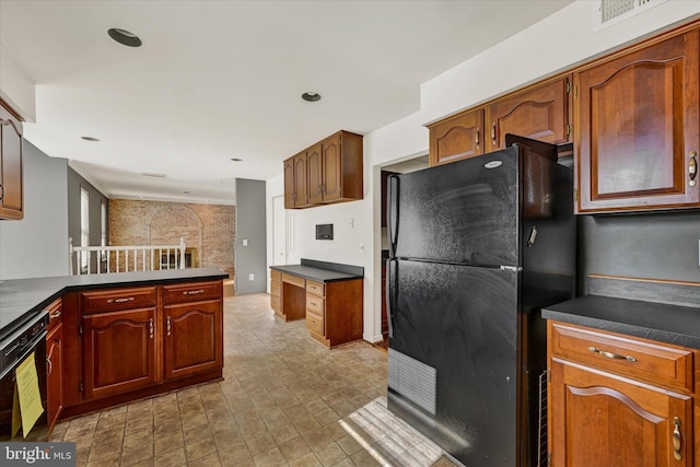 kitchen with kitchen peninsula and black appliances