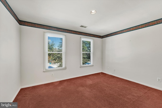 unfurnished room featuring carpet