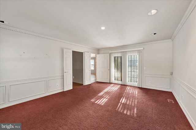 carpeted empty room with ornamental molding