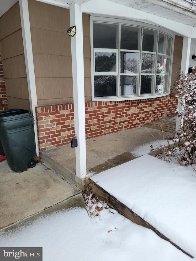 view of snow covered patio