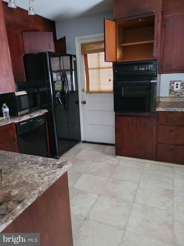 kitchen featuring stone countertops, black appliances, and open shelves