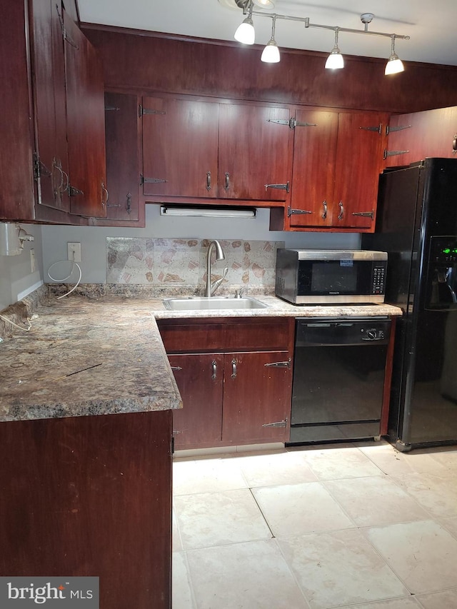 kitchen featuring black appliances and a sink