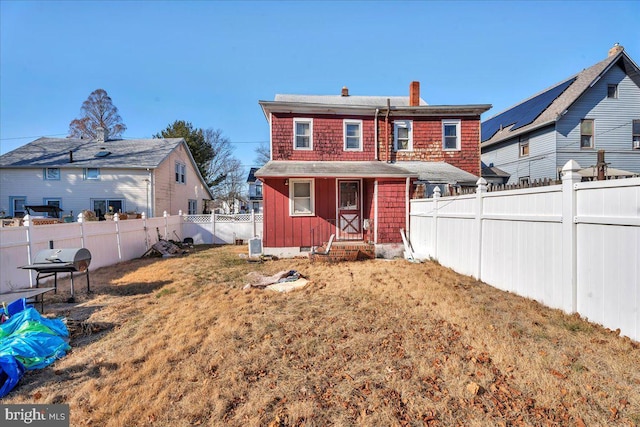 back of house with a yard