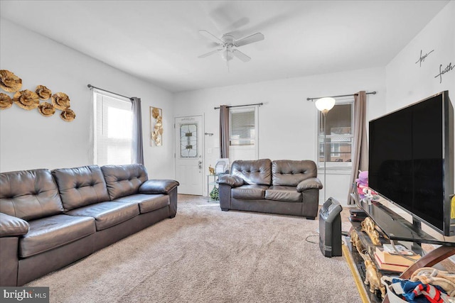 living room with carpet flooring and ceiling fan