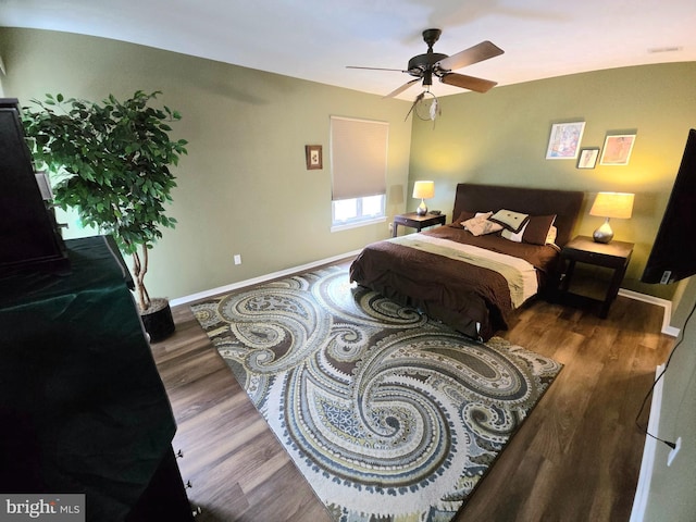 bedroom featuring dark hardwood / wood-style floors and ceiling fan