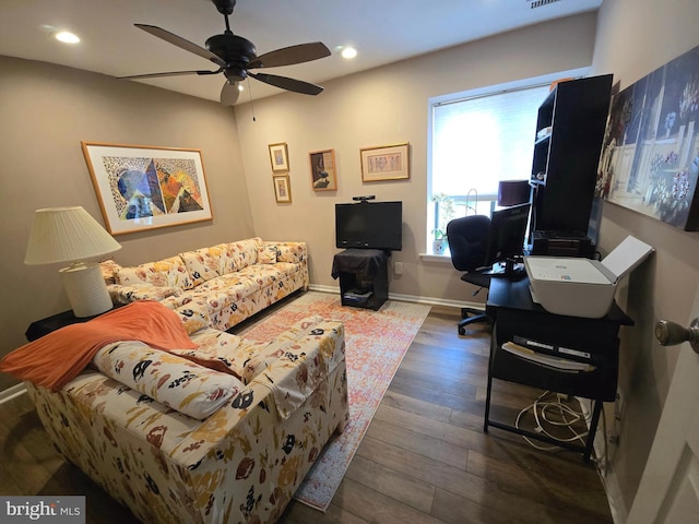 office space with ceiling fan and dark hardwood / wood-style floors