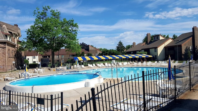 view of swimming pool featuring a patio area